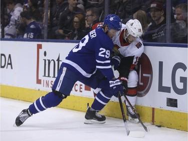 Toronto's William Nylander fights for the puck with Ottawa's Derick Brassard during the first period. Jack Boland/Postmedia