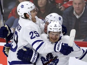 Maple Leafs forward William Nylander, left, celebrates with Auston Matthews and Connor Carrick after scoring on a penalty shot against the Blackhawks during overtime of a game on Jan. 24.