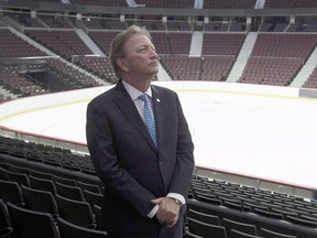 Senators owner Eugene Melnyk stands near the ice as members of the media are given a tour of changes to the Canadian Tire Centre in Ottawa on September 7, 2017. (THE CANADIAN PRESS/Adrian Wyld)