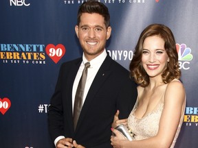 In this Sept. 15, 2016 file photo, Michael Buble, left, and wife Luisana Lopilato, attend "Tony Bennett Celebrates 90: The Best Is Yet to Come" at Radio City Music Hall, in New York. (Andy Kropa/Invision/AP File)