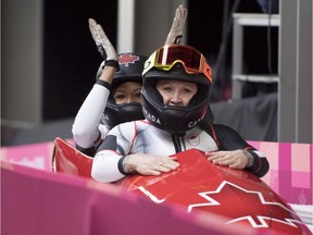 Canada's Kaillie Humphries and Phylicia George celebrate their bronze medal following women's bobsled at the Olympic sliding centre during the Pyeongchang 2018 Winter Olympic Games in South Korea, Wednesday, Feb. 21, 2018.