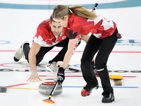 Canada's John Morris and Kaitlyn Lawes curl in the mixed doubles gold medal game at the Pyeongchang Olympics on Feb. 13.