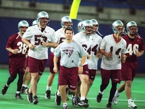 Head coach Marcel Bellefeuille leads the 2000 Gee-Gees football team onto the field in Toronto for practice before the Vanier Cup national championship game against the Regina Rams. The Gee-Gees won that game 42-39. Bellefeuille will be among those inducted into the uOttawa football hall of fame in late April.