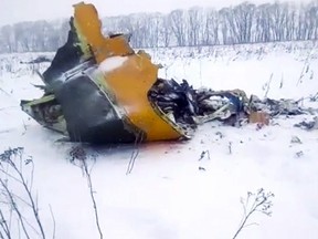 In this screen grab provided by Life.ru, the wreckage of a AN-148 plane is seen in Stepanovskoye village, about 40 km from the Domodedovo airport, near Moscow, Russia, Sunday, Feb. 11, 2018.