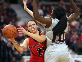 Carleton Ravens Elizabeth Leblanc tries to get the ball past Ottawa GeeGees Adonaelle Mousambote during the 12th annual Capital Hoops Classic women's game held at Canadian Tire Centre, in Ottawa on February 02, 2018. (Jana Chytilova/Ottawa Citizen)