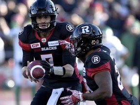 Ottawa Redblacks quarterback Trevor Harris (7) hands off the ball to William Powell (29) in Eastern semifinal against the Saskatchewan Roughriders in Ottawa on Sunday, Nov. 12, 2017. (THE CANADIAN PRESS/Justin Tang)