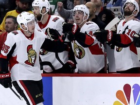Senators centre Matt Duchene, left, celebrates with teammates after scoring a goal against the Blackhawks during the second period of a game in Chicago on Feb. 21.