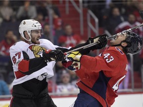 Defenceman Ben Harpur (67) gets his stick up on the Capitals' Tom Wilson (43) in a Nov. 22 game, during one of his previous NHL callups by the Senators.