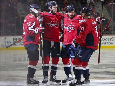 Washington Capitals right wing Tom Wilson, second from left, celebrates his goal against the Ottawa Senators with teammates Nicklas Backstrom (19), Michal Kempny and Jakub Vrana (13) during the second period of an NHL hockey game Tuesday, Feb. 27, 2018, in Washington.