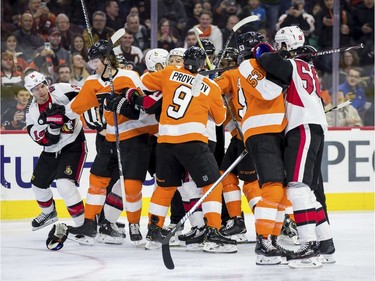 A scrum breaks out between the Philadelphia Flyers and the Ottawa Senators during the first period.