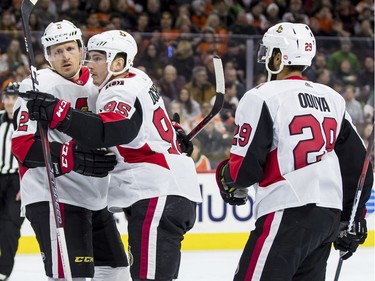 The Ottawa Senators' Matt Duchene, centre, celebrates his goal with Dion Phaneuf, left, and Johnny Oduya, right, during the first period.