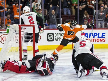 The Philadelphia Flyers' Sean Couturier celebrates after scoring during the second period.