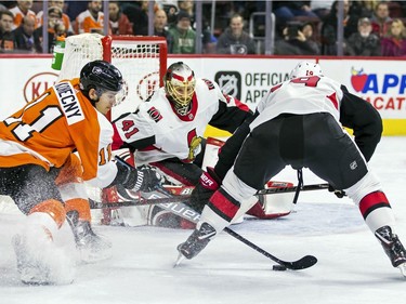 The Philadelphia Flyers' Travis Konecny tries to get the puck away from the Ottawa Senators' Derick Brassard during the second period.