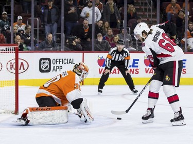 Senators winger Mike Hoffman starts to drag the puck back to his right before tipping it past Flyers netminder Michal Neuvirth for the game-winning goal during the shootout on Saturday.