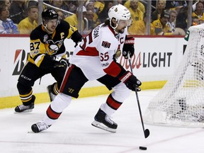 Penguins captain Sidney Crosby pursues the Senators' Erik Karlsson in Game 1 of the Eastern Conference final last May 13. AP Photo/Gene J. Puskar