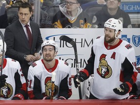 Forward Zack Smith, right, stands at the Senators' bench during the first period of Tuesday's game against the Penguins in Pittsburgh.