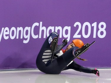 Netherland's Suzanne Schulting falls during the women's 500-metre short-track speed skating heats on Saturday. Leah Hennel/Postmedia