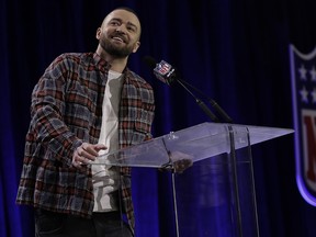 Justin Timberlake answers questions during a news conference for the NFL Super Bowl LII halftime show Thursday, Feb. 1, 2018, in Minneapolis. (AP Photo/Matt Slocum)