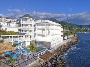 This Jan. 30, 2018 photo shows the Fort Young Hotel on the Caribbean island of Dominica. The hotel has partly reopened following September's Hurricane Maria, which heavily impacted Dominica. ​The hotel is offering a​ "voluntourism package" for spring breakers to enjoy the Caribbean experience while giving back, by inviting visitors to help clear debris on a segment of the Waitukubuli National Trail.