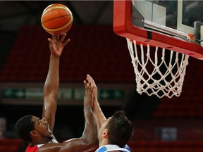 Files: Canada's Tristan Thompson, left, shoots over Uruguay's Esteban Batista at a FIBA World Cup qualifying basketball game in Caracas, Venezuela in 2013.