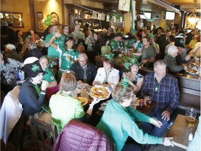 Revellers celebrate at D'Arcy McGee's in Kanata on Saturday.   Patrick Doyle/Postmedia