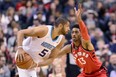 Raptors' Malcolm Miller guards Charlotte Hornets' Nicolas Batum during Sunday night's game. (THE CANADIAN PRESS)