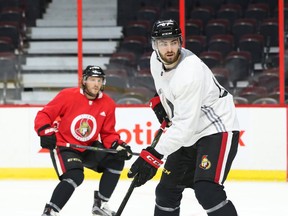 Senators defenceman Ben Harpur (right) played one of his best games of the season on Thursday. (JEAN LEVAC/Postmedia Network)