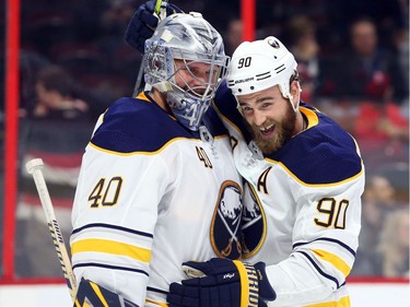 Goalie Robin Lehner and Ryan O'Reilly of the Buffalo Sabres celebrate their shootout win against the Ottawa Senators.