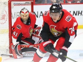 Craig Anderson and Mark Borowiecki (R) of the Ottawa Senators in action against the Buffalo Sabres during second period of NHL action at Canadian Tire Centre in Ottawa, March 08, 2018.