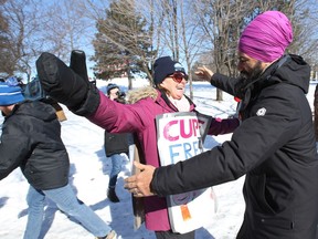 Jagmeet Singh, leader of the federal NDP party gets a hug from a member of CUPE 2424 who is on strike at Carleton Unversity Ottawa, March 20, 2018.