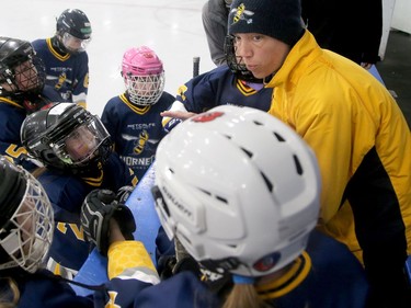 Metcalfe Hornets head coach Karla George goes over strategy with her girls during a break.  Julie Oliver/Postmedia
