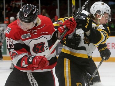 Ottawa's Sam Bitten (left) clashes with Marian Studenic in front of Hamilton's net during playoff game 3 between the Ottawa 67s and the Hamilton Bulldogs Tuesday (March 27, 2018) at TD Place in Ottawa.