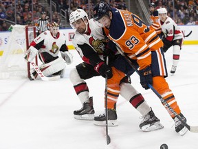 Senators defenceman Cody Ceci checks Oilers centre Ryan Nugent-Hopkins (93) during an Oct. 14 game in Edmonton. The Senators won that contest 6-1. David Bloom/Postmedia