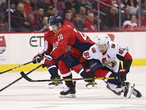Lars Eller of the Capitals skates past Mark Stone of the Senators during the first period of Tuesday's game in Washington.
