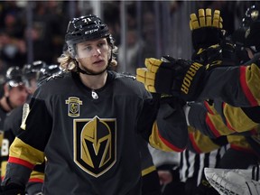 Golden Knights forward William Karlsson celebrates with teammates on the bench after scoring a first-period goal against the Kings during a game on Tuesday.