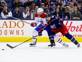 Blue Jackets defenceman Ian Cole battles for position with the Canadiens' Jeff Petry in a game on Monday. The Blue Jackets are 7-2 since acquiring Cole, via the Senators, just before the trade deadline.