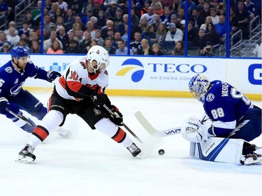 Andrei Vasilevskiy #88 of the Tampa Bay Lightning stops a shot from Tom Pyatt #10 of the Ottawa Senators during a game  at Amalie Arena on March 13, 2018 in Tampa, Florida.