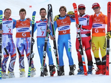 The medallists for the visually impaired men's giant slalom ski event on Wednesday include, left to right, silver medallists Jakub Krako and his guide Branislav Brozman of Slovakia, gold medallists Giacomo Bertagnolli and guide Fabrizio Casal of Italy and bronze medallists Mac Marcoux of Canada and guide Jack Leitch.