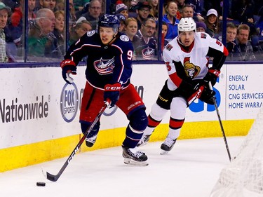 Artemi Panarin of the Blue Jackets skates the puck away from Cody Ceci of the Senators during the second period.
