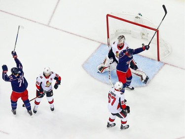 Nick Foligno (71) and Thomas Vanek of the Blue Jackets react after a shot by teammate Markus Nutivaara beats Senators netminder Mike Condon in the second period. It proved to be the winning goal.