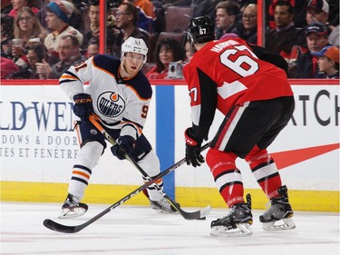 Drake Caggiula #91 of the Edmonton Oilers skates with the puck against Ben Harpur #67 of the Ottawa Senators in the first period at Canadian Tire Centre on March 22, 2018 in Ottawa.