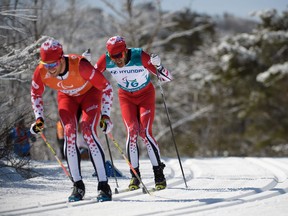 Brian McKeever, right, and his guide Graham Nishikawa compete in the cross country skiing men's visually impaired 10-kilometre classic on Saturday.