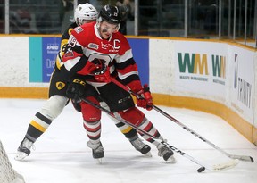 Ottawa 67's captain Travis Barron (right) swings around the back of Hamilton's net with the puck as Nicolas Mattinen (Hamilton Bulldogs) pursues during their OHL playoff game 4 at TD Place in Ottawa Wednesday (March 28, 2018) night. Julie Oliver/Postmedia