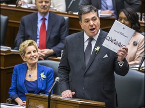 Ontario Finance Minister Charles Sousa delivers the provincial budget at the Ontario Legislature, while Ontario Premier Kathleen Wynne looks on in Toronto, Ont. on Wednesday March 28, 2018. Ernest Doroszuk/Toronto Sun/Postmedia Network