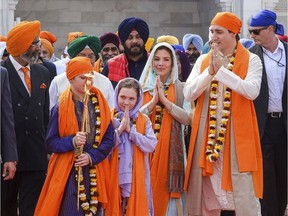 Prime Minister Justin Trudeau walks with his family members during their visit to Golden Temple, in Amritsar, India, Wednesday, Feb. 21, 2018.