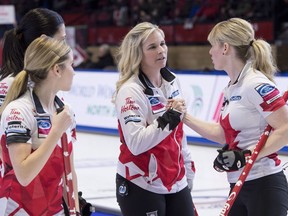 Canada skip Jennifer Jones celebrates her team's victory over Russia with teammate lead Dawn McEwen, right, at the World Women's Curling Championship Thursday, March 22, 2018 in North Bay, Ont.
