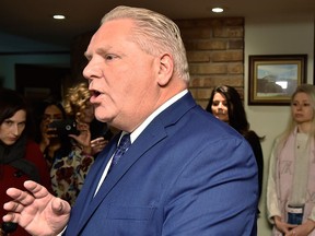 Former Toronto city councillor Doug Ford holds a news conference in Toronto, Monday, Jan.29, 2018 as family members look on.