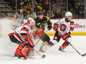 With Bulldogs forward Will Bitten on the edge of his crease, 67's netminder Olivier Tremblay tries to follow the puck during Game 5 of their playoff series on Friday. Tremblay has used up his junior hockey eligibility and cannot return to the 67's next season. Brandon Taylor photo.