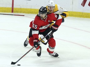 In this Feb. 8, 2018, file photo, Ottawa Senators' Erik Karlsson (65) is chased by Nashville Predators Kyle Turris (8) in Ottawa. (Fred Chartrand/The Canadian Press via AP, File)