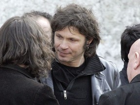 FILE - In this March 20 2009 file photo, French rock singer Bertrand Cantat, center, attends the funeral ceremony of French rock singer Alain Bashung in Paris. Cantat, who was convicted of killing his girlfriend 15 years ago, the actress Marie Trintignant, has pulled out from all the festivals he was scheduled to appear in this summer amid growing protests from feminist groups and politicans.